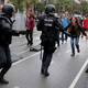 A woman yells at riot police near a a polling station for the banned independence referendum in Barcelona, Spain, October 1, 2017.